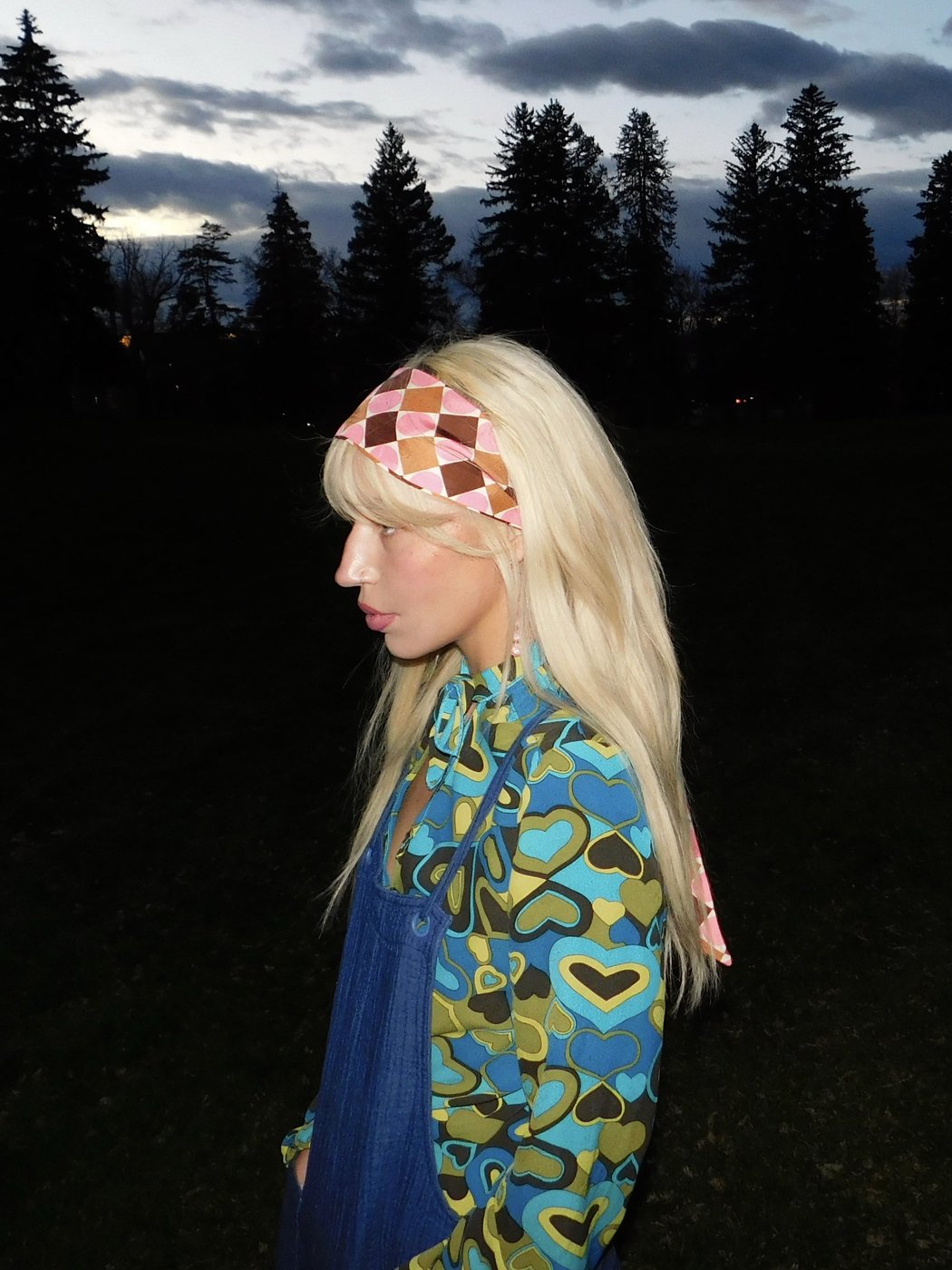 Darla Jane in profile, wearing a patterned headband